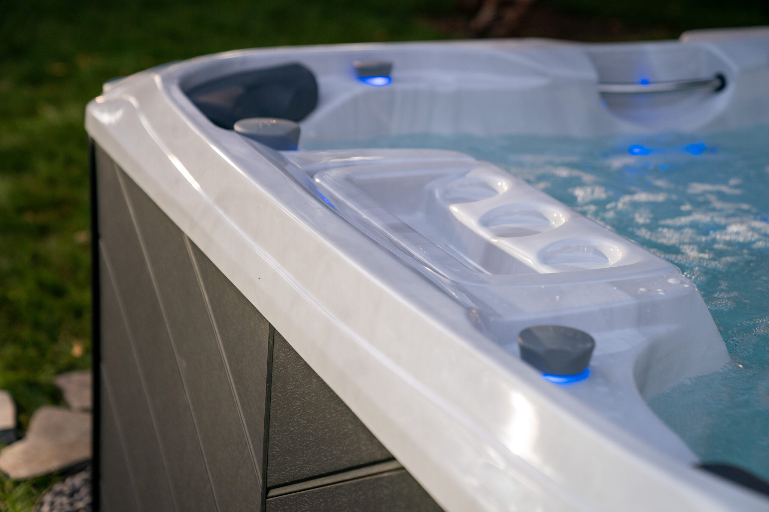 Close-up underwater photo of a backyard hot tub in Yorktown Heights, NY. Hydrotherapy jet solutions offered by Nejame & Sons Pool & Spa Company.